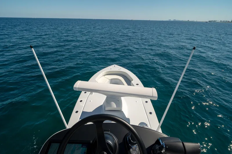 Slide: The Image of 2026 Conch 33 boat navigating on open sea under clear blue sky. - 40