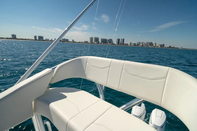 Slide: The Image of Luxury Conch 33 boat interior with city skyline in the background, 2026 model. - 42