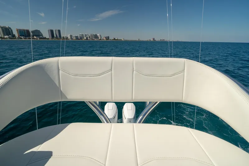 Slide: The Image of 2026 Conch 33 boat interior with ocean view and distant city skyline. - 43