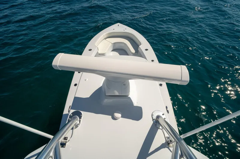 Slide: The Image of Bow view of 2026 Conch 33 boat on sparkling blue water. - 45