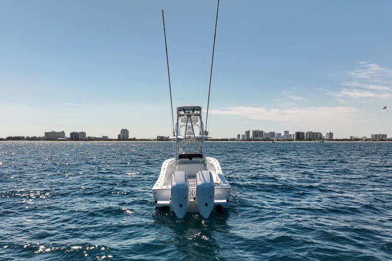 Slide: The Image of 2026 Conch 33 boat on ocean with city skyline in background. - 5