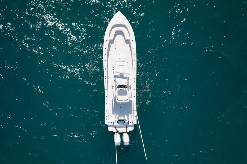 Slide: The Image of Aerial view of 2026 Conch 33 boat on clear blue water. - 6