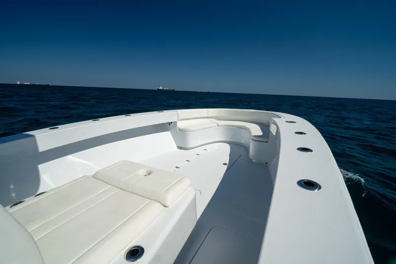 Slide: The Image of 2026 Conch 33 boat with white seating on open ocean. - 9