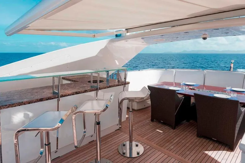 Slide: The Image of Luxurious deck of 2012 Italyachts Leopard yacht with bar and dining area. - 10