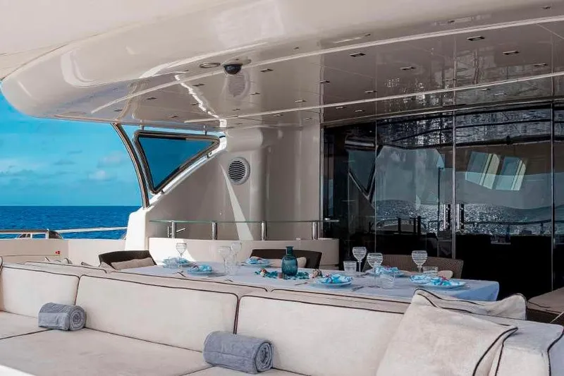 Slide: The Image of Luxurious 2012 Italyachts Leopard yacht deck with elegant dining setup and ocean view. - 14