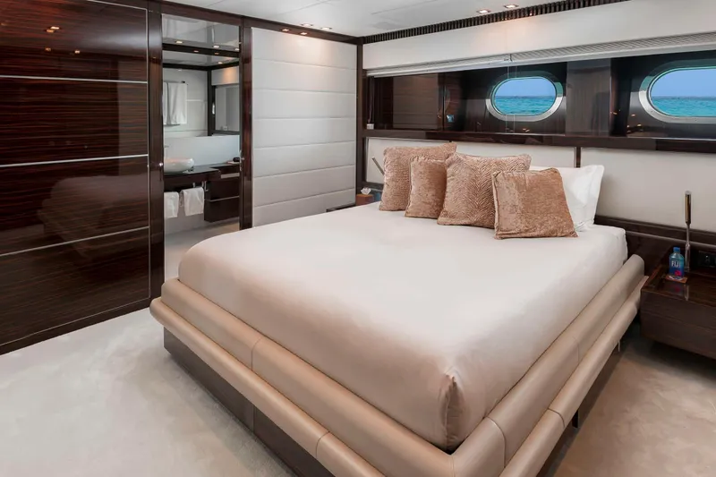 Slide: The Image of Luxurious bedroom interior on 2012 Italyachts Leopard yacht, featuring elegant design and ocean view. - 9