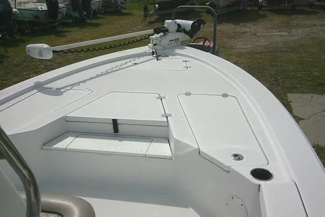 Slide: The Image of 2022 Sportsman Tournament 214 Bay Boat deck with trolling motor and storage compartments. - 15