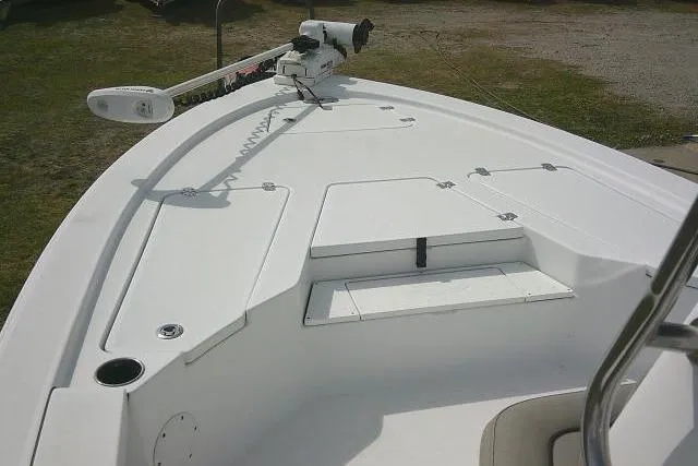 Slide: The Image of 2022 Sportsman Tournament 214 Bay Boat deck with trolling motor and storage compartments. - 18