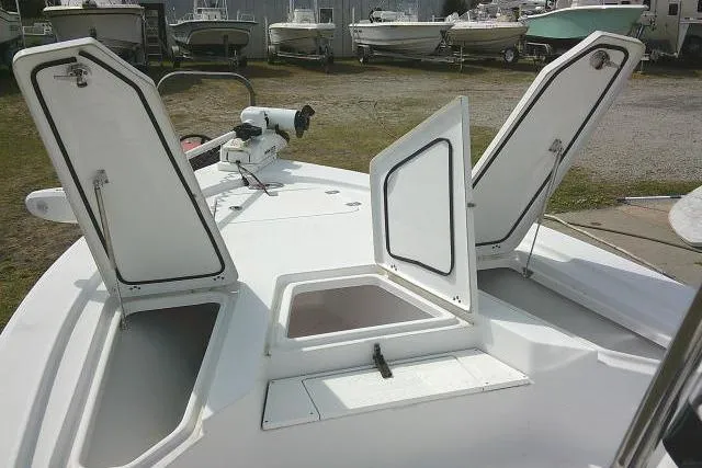 Slide: The Image of 2022 Sportsman Tournament 214 Bay Boat with open storage compartments on deck. - 19