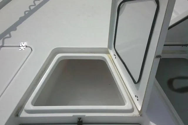 Slide: The Image of Open storage compartment on 2022 Sportsman Tournament 214 Bay Boat deck. - 21