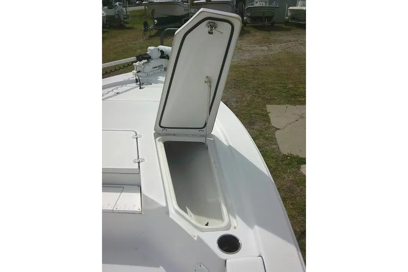 Slide: The Image of 2022 Sportsman Tournament 214 Bay Boat with open storage compartment on deck. - 22