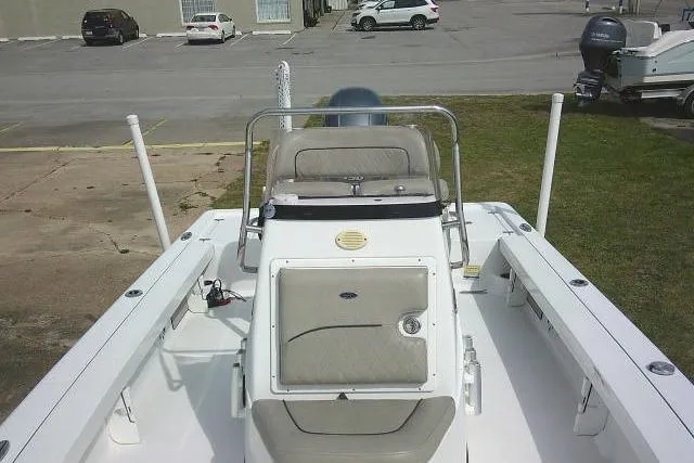 Slide: The Image of 2022 Sportsman Tournament 214 Bay Boat with center console in a parking area. - 24