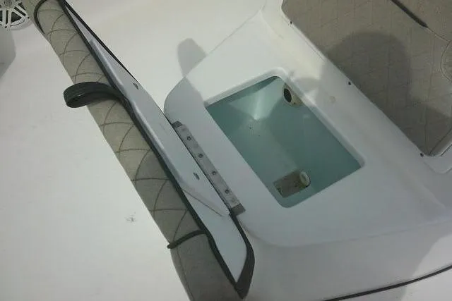 Slide: The Image of 2022 Sportsman Tournament 214 Bay Boat interior with seating and storage compartment. - 25