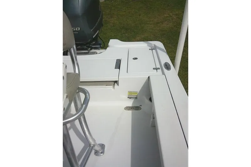 Slide: The Image of 2022 Sportsman Tournament 214 Bay Boat interior with seating and storage compartments. - 29