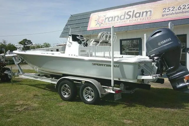 Slide: The Image of 2022 Sportsman Tournament 214 Bay Boat on trailer outside dealership. - 3