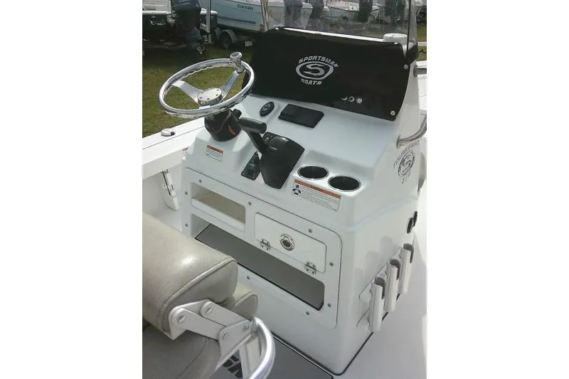 Slide: The Image of 2022 Sportsman Tournament 214 Bay Boat console with steering wheel and controls. - 32