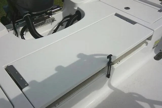 Slide: The Image of 2022 Sportsman Tournament 214 Bay Boat deck with storage compartment. - 38