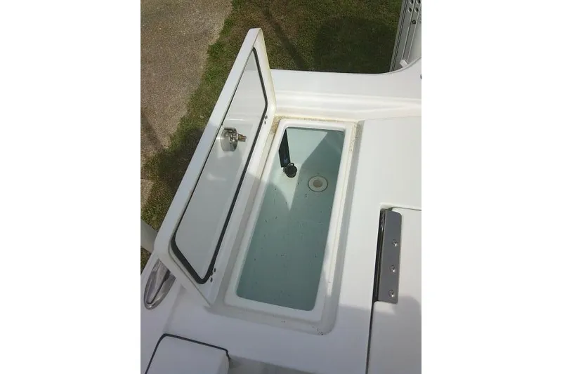 Slide: The Image of Open storage compartment on 2022 Sportsman Tournament 214 Bay Boat. - 39