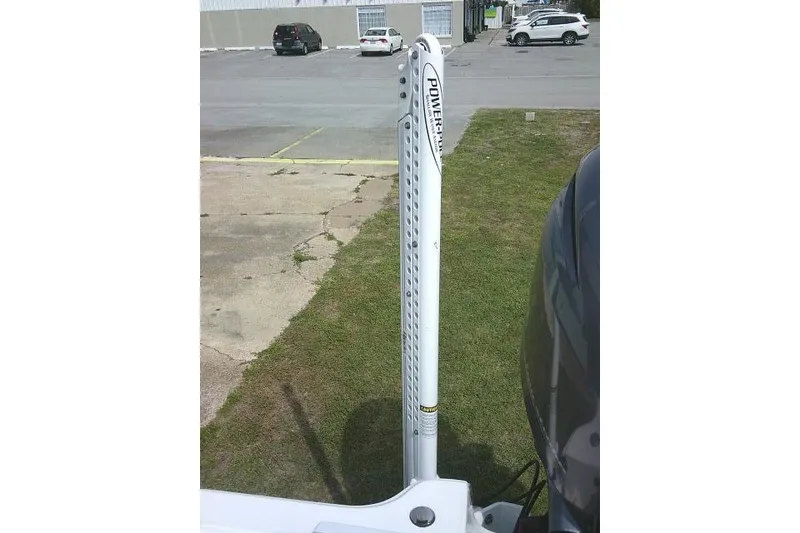 Slide: The Image of 2022 Sportsman Tournament 214 Bay Boat with Power-Pole anchor system in a parking lot. - 41