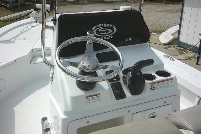 Slide: The Image of 2022 Sportsman Tournament 214 Bay Boat console with steering wheel and controls. - 46