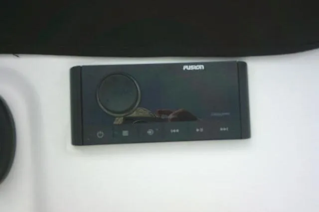 Slide: The Image of Fusion audio system on 2022 Sportsman Tournament 214 Bay Boat dashboard. - 49