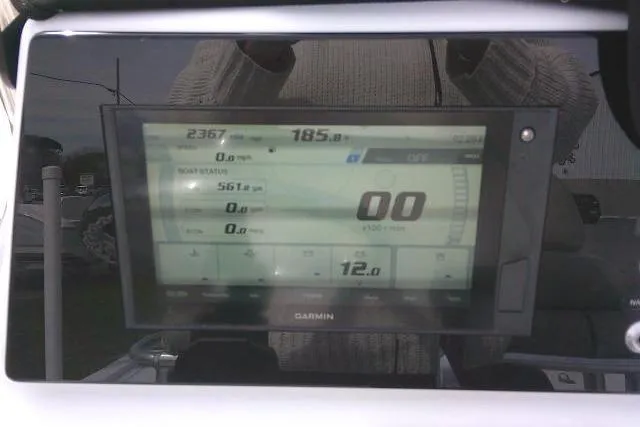 Slide: The Image of Garmin display on 2022 Sportsman Tournament 214 Bay Boat dashboard showing navigation data. - 51