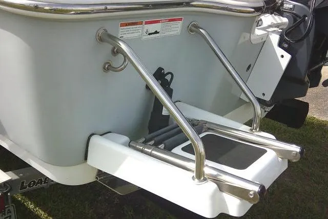Slide: The Image of 2022 Sportsman Tournament 214 Bay Boat with stainless steel swim ladder. - 7