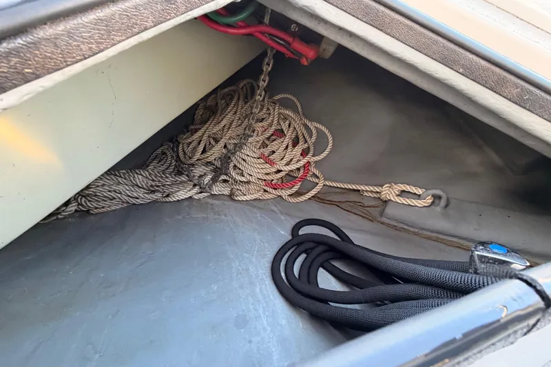Slide: The Image of Storage compartment with ropes on a 1998 Sea Ray 420 Aft Cabin boat. - 18