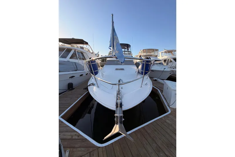 Slide: The Image of 1998 Sea Ray 420 Aft Cabin yacht docked at marina, front view. - 3
