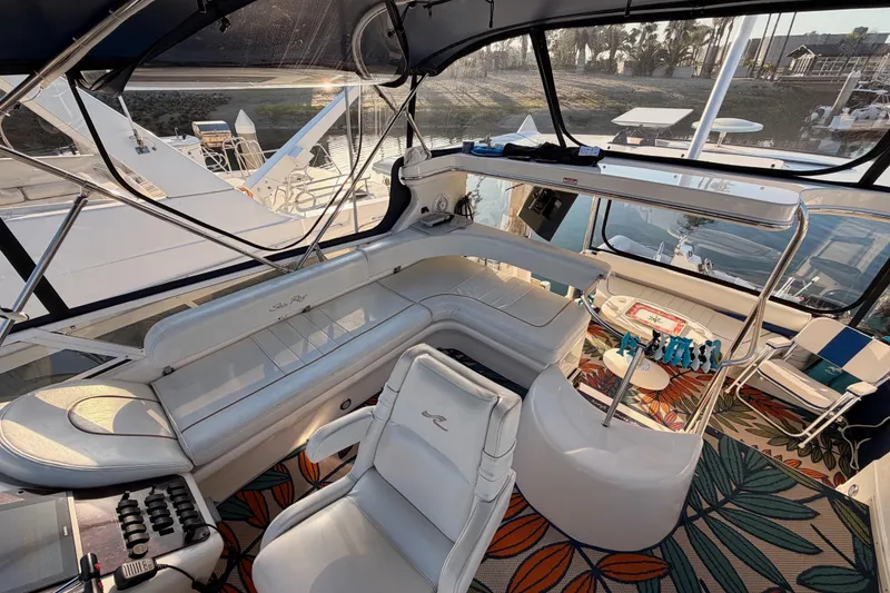 Slide: The Image of Luxurious 1998 Sea Ray 420 Aft Cabin interior with plush seating and vibrant decor. - 37