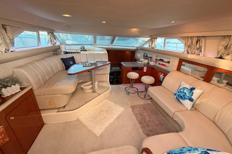 Slide: The Image of Luxurious interior of 1998 Sea Ray 420 Aft Cabin yacht with elegant seating and decor. - 42