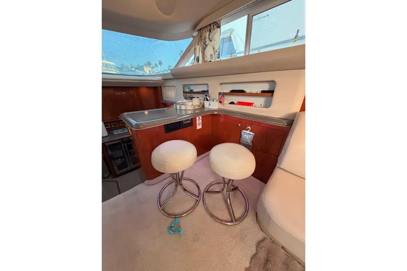 Slide: The Image of Interior of 1998 Sea Ray 420 Aft Cabin with bar stools and countertop. - 47