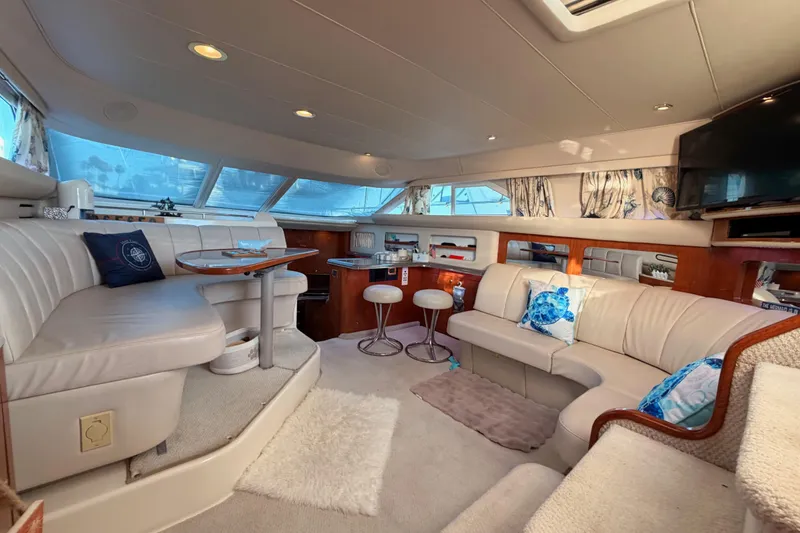 Slide: The Image of Luxurious interior of 1998 Sea Ray 420 Aft Cabin yacht with elegant seating and decor. - 83