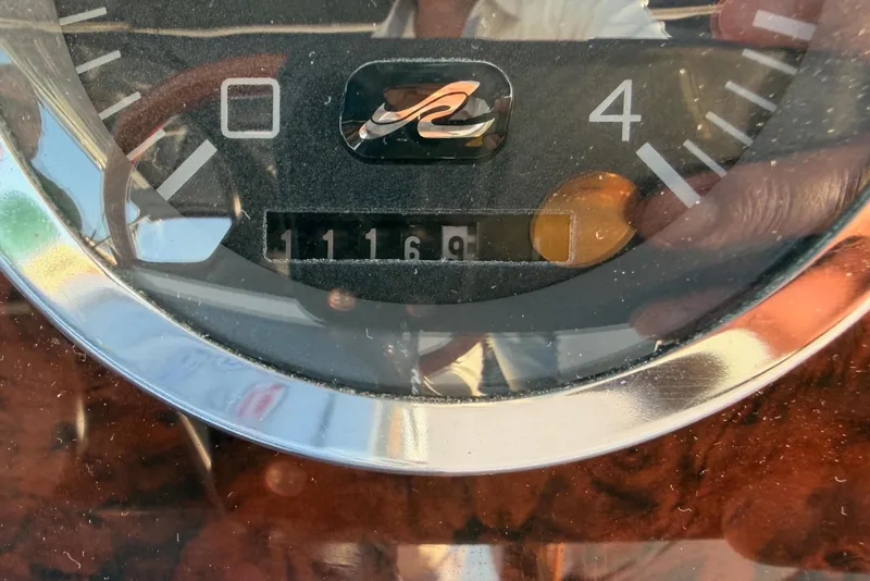 Slide: The Image of Close-up of a 1998 Sea Ray 420 Aft Cabin boat gauge showing 1169 hours. - 84