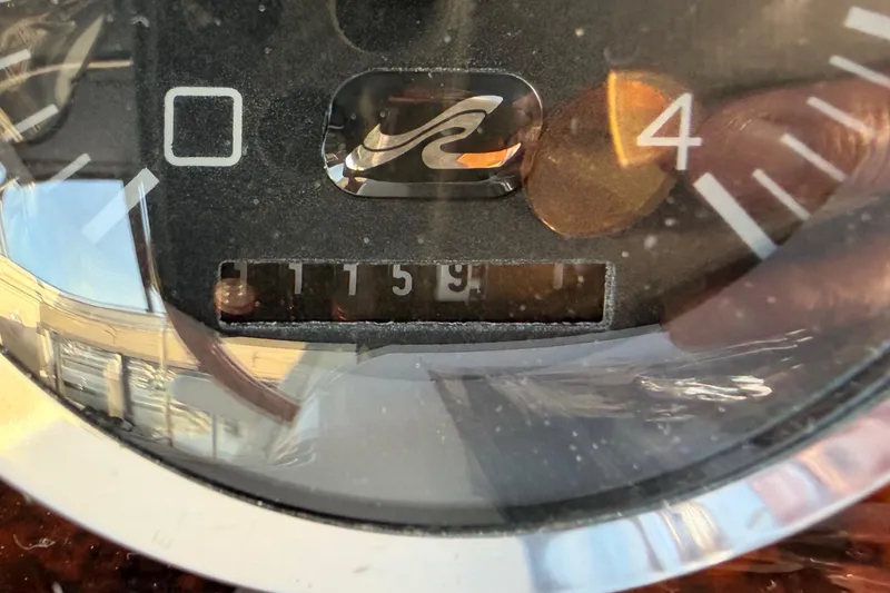 Slide: The Image of Close-up of a Sea Ray 420 Aft Cabin 1998 boat gauge with reflections. - 85