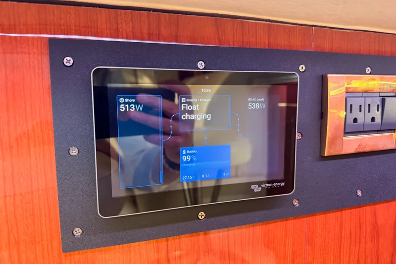 Slide: The Image of Control panel on 1998 Sea Ray 420 Aft Cabin displaying power and battery status. - 87