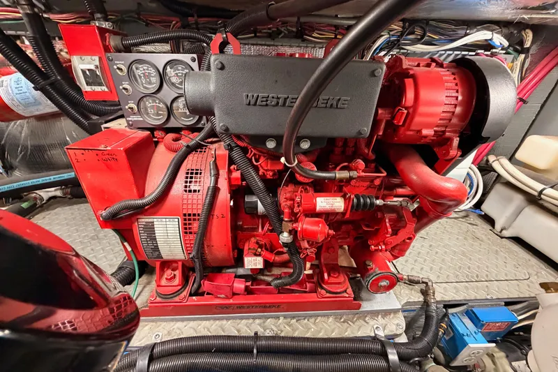 Slide: The Image of Engine room of 1998 Sea Ray 420 Aft Cabin with Westerbeke generator. - 91