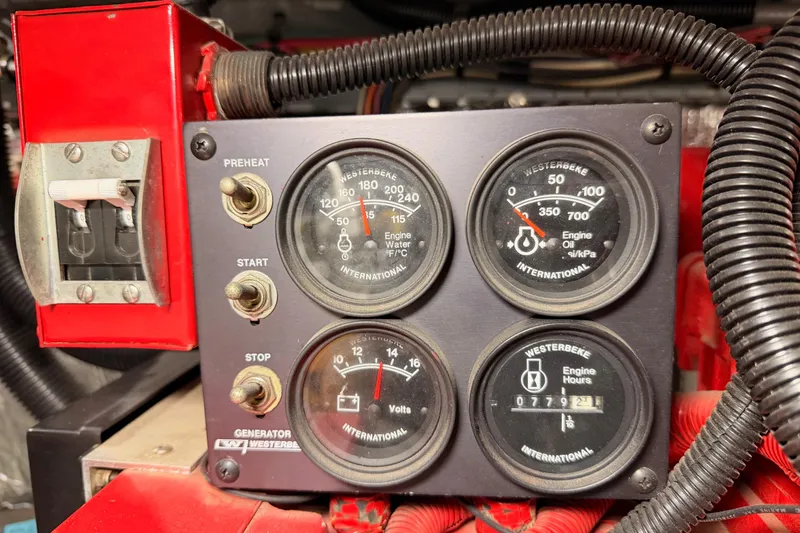 Slide: The Image of Control panel of a 1998 Sea Ray 420 Aft Cabin boat engine. - 92