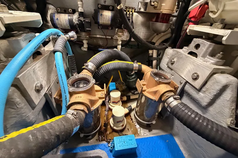 Slide: The Image of Engine room of a 1998 Sea Ray 420 Aft Cabin with hoses and filters. - 95