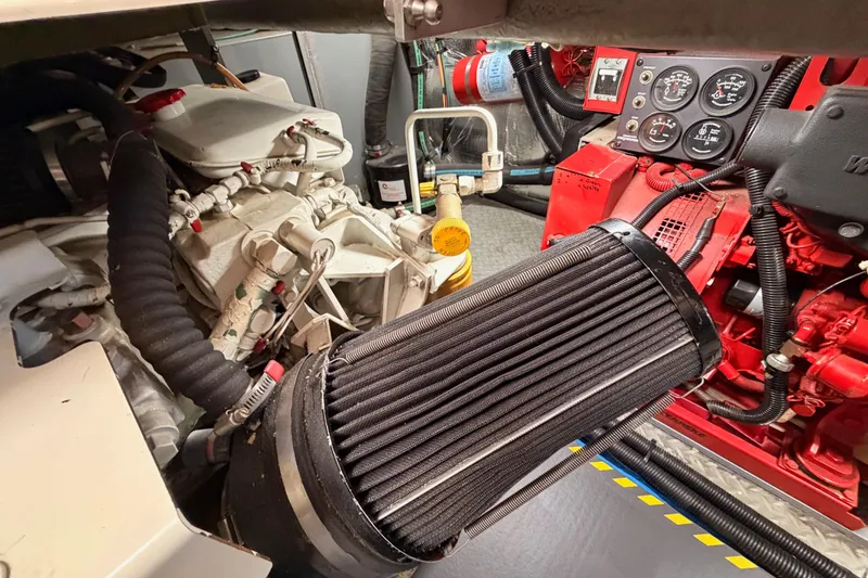 Slide: The Image of Engine room of 1998 Sea Ray 420 Aft Cabin with visible components and gauges. - 97