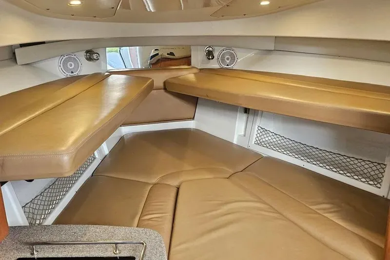 Slide: The Image of Interior cabin of 2007 Sailfish 30-06 Express boat with tan seating and storage. - 13