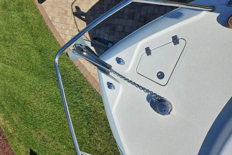 Slide: The Image of Bow of 2007 Sailfish 30-06 Express boat with anchor chain and hatch. - 6