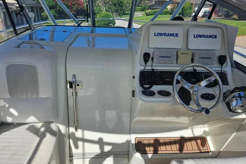 Slide: The Image of 2007 Sailfish 30-06 Express boat cockpit with steering wheel and navigation equipment. - 8