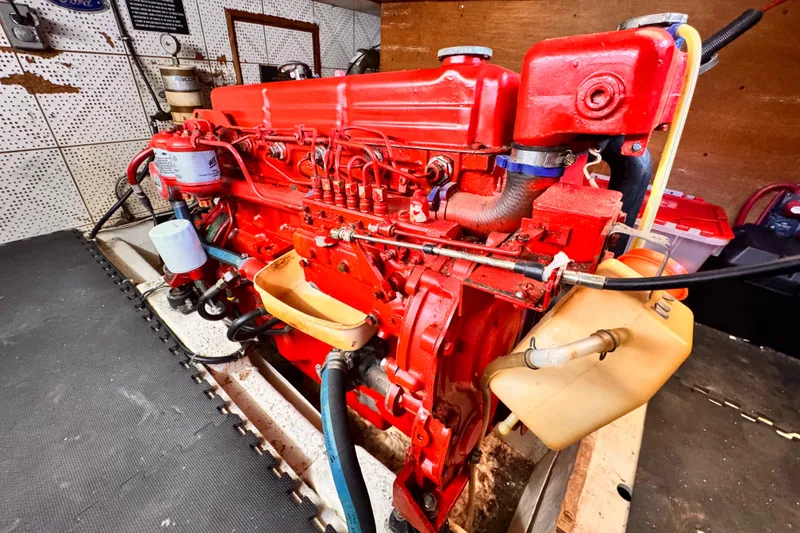 Slide: The Image of Red engine of a 1980 Hershine Trawler, showcasing detailed mechanical components. - 24
