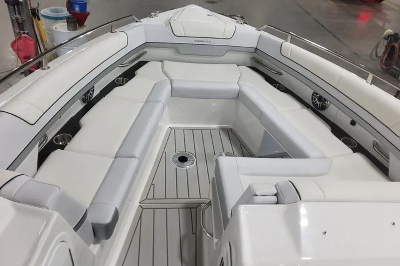 Slide: The Image of 2026 Formula 330 Crossover Bowrider I/O interior with spacious seating and sleek design. - 10