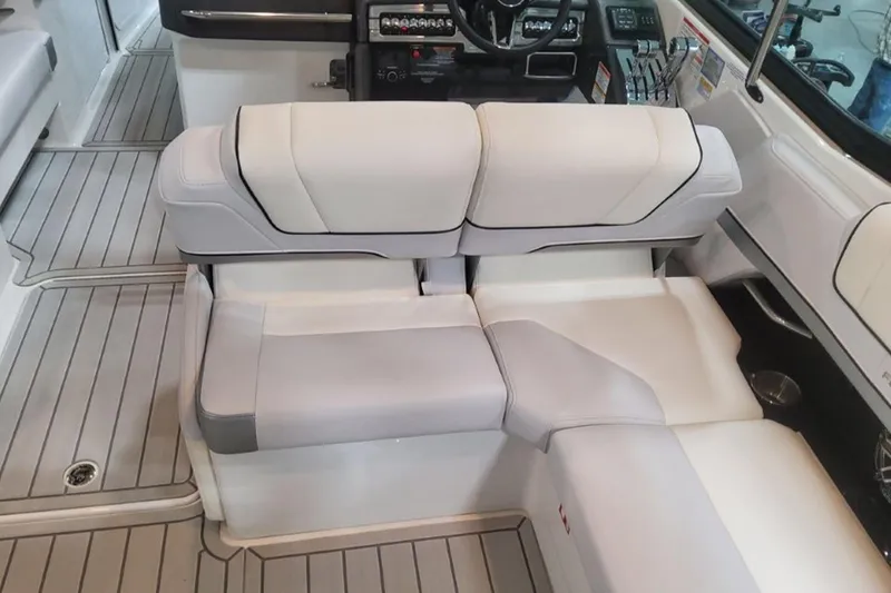 Slide: The Image of 2026 Formula 330 Crossover Bowrider I/O interior with sleek seating and modern dashboard. - 12