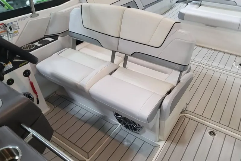 Slide: The Image of 2026 Formula 330 Crossover Bowrider I/O interior with white seating and modern design. - 3
