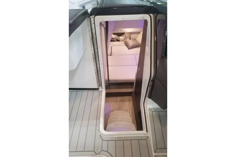 Slide: The Image of Interior view of 2026 Formula 330 Crossover Bowrider I/O cabin with seating area. - 5