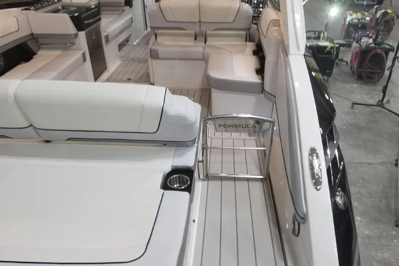 Slide: The Image of 2026 Formula 330 Crossover Bowrider I/O interior with luxurious seating and sleek design. - 6