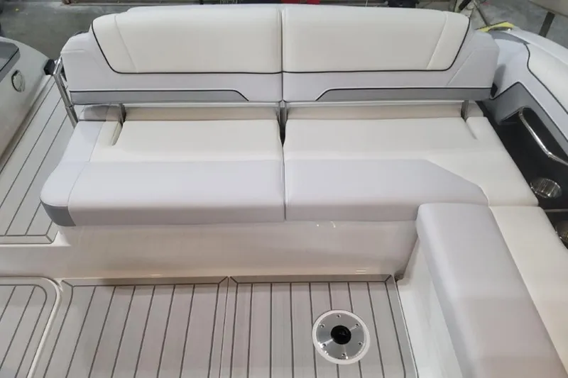 Slide: The Image of 2026 Formula 330 Crossover Bowrider I/O interior with sleek white seating and modern design. - 7